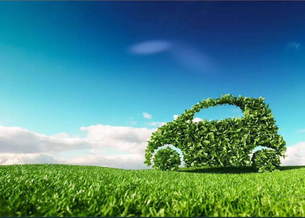 Eco-friendly green car on grass